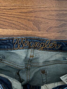 Wrangler High Rise Slim Boot Jeans in Dark Blue with Gold Stitching
